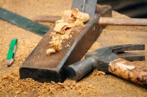 Closeup of carpentry tools on wooden table.